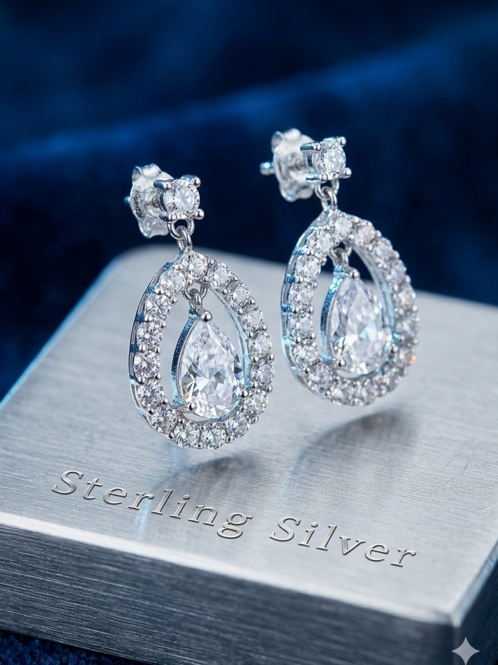 Contessa Di Capri Sterling Silver Teardrop Halo Dangle Earrings in Silver